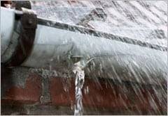 stevesGutterleaking Fully extended ladder and equipment setup for high-reach gutter maintenance