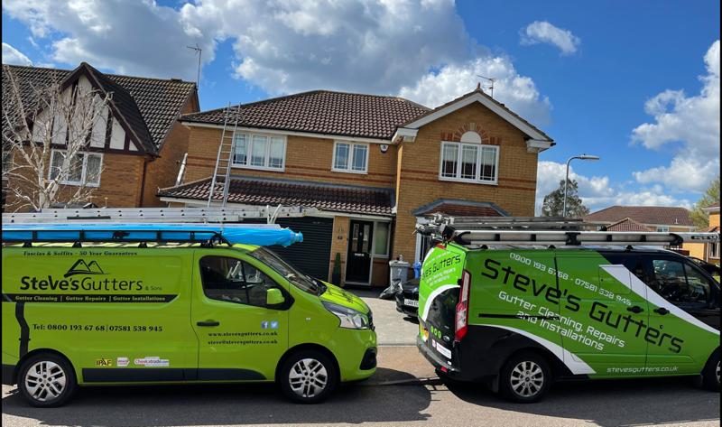 Steves Gutters Technician installing new guttering system on residential property in Hertfordshire